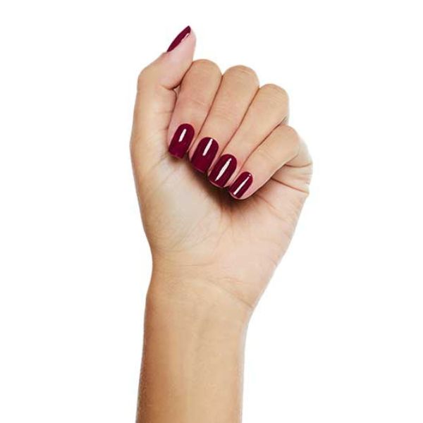Foto de mão feita com esmaltação vinho.